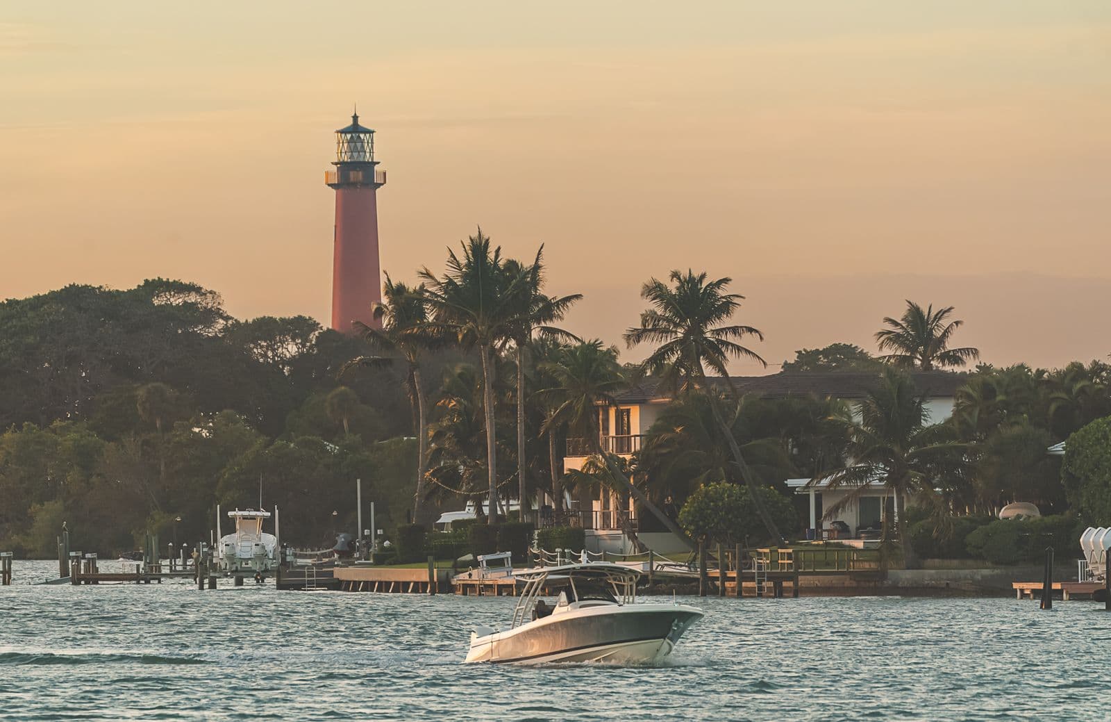 Boat passing in front of Jupiter Lighthouse.