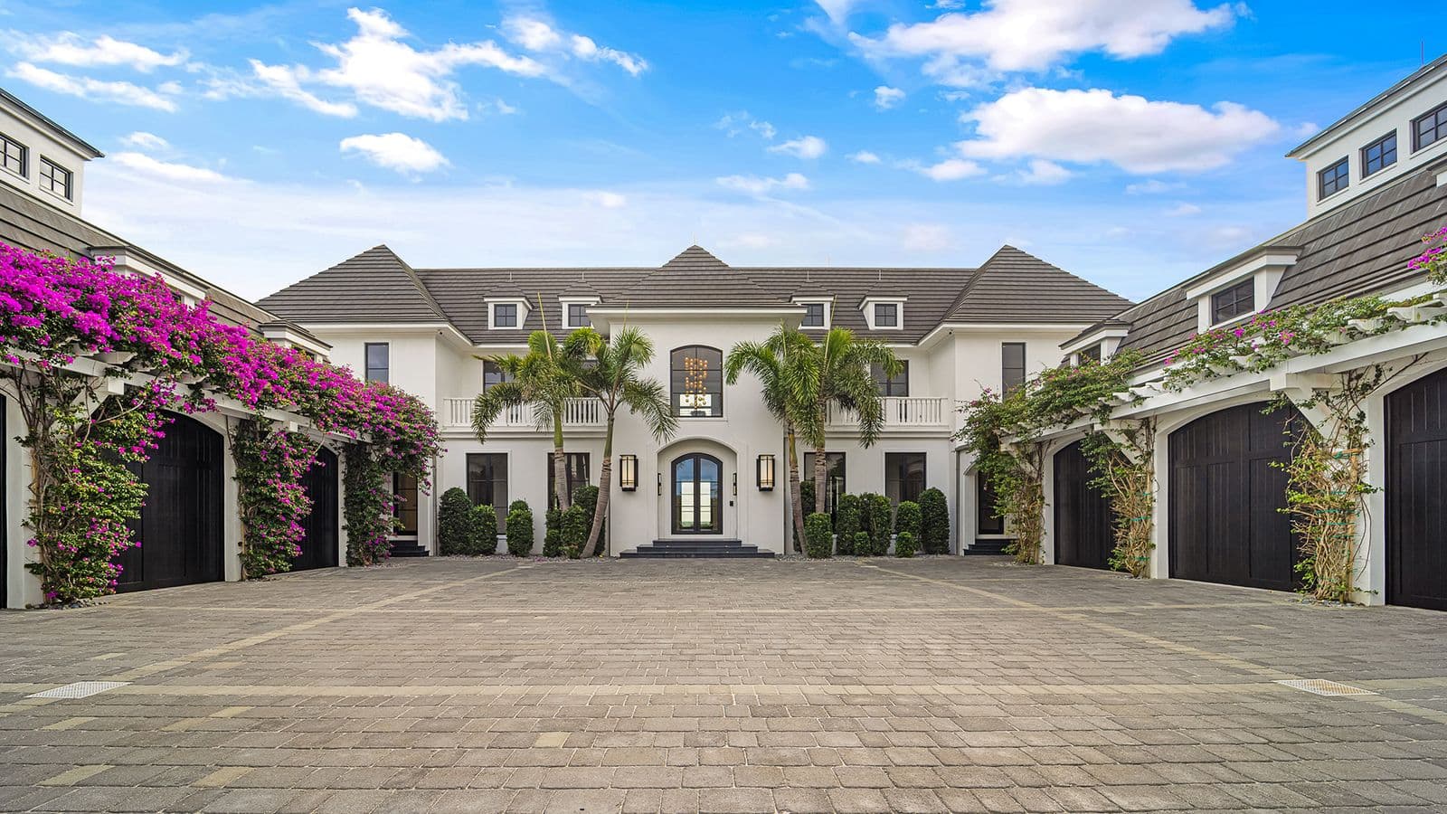 Front facing image of a large beach home.