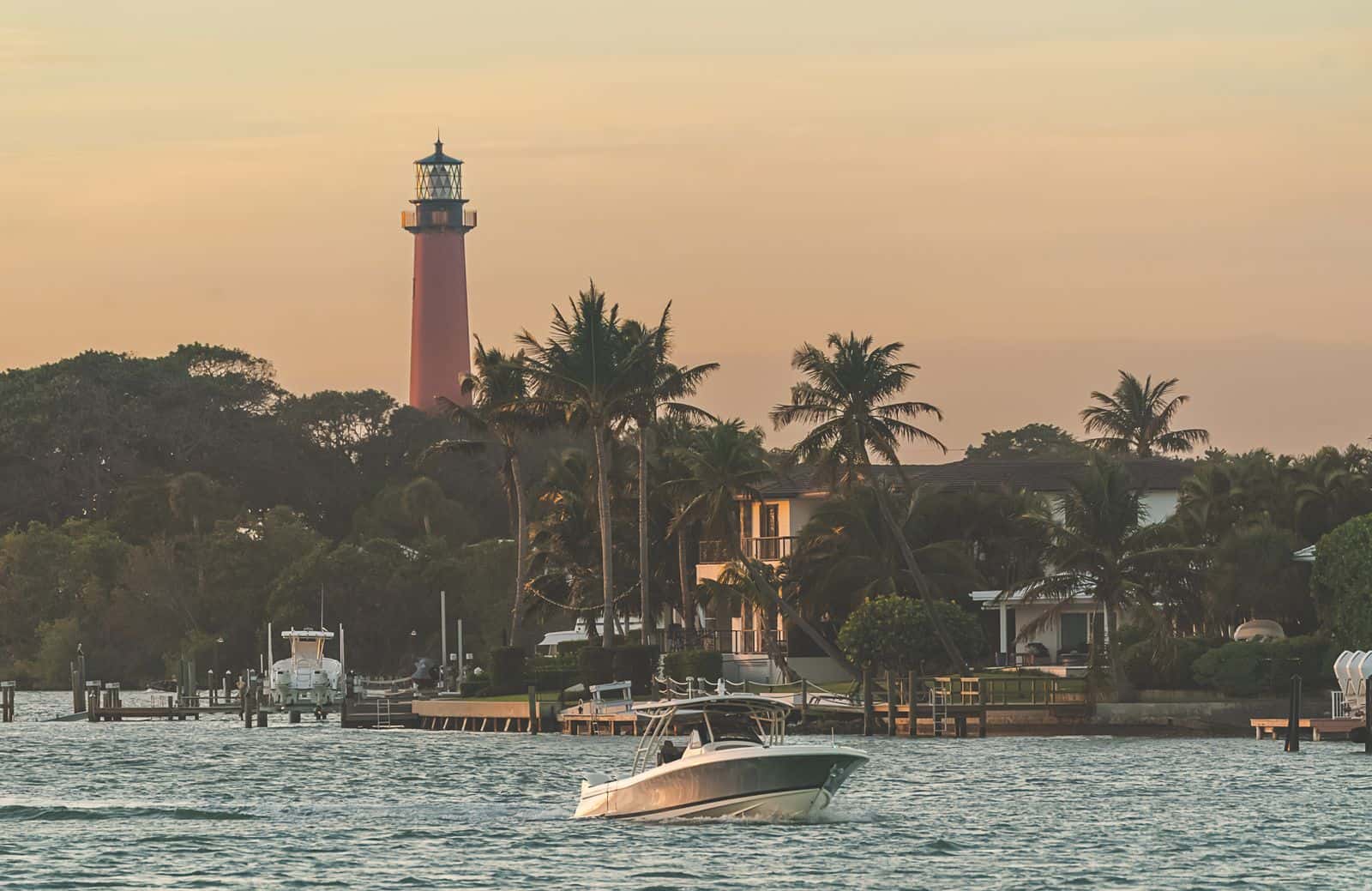 Boat passing in front of Jupiter Lighthouse.